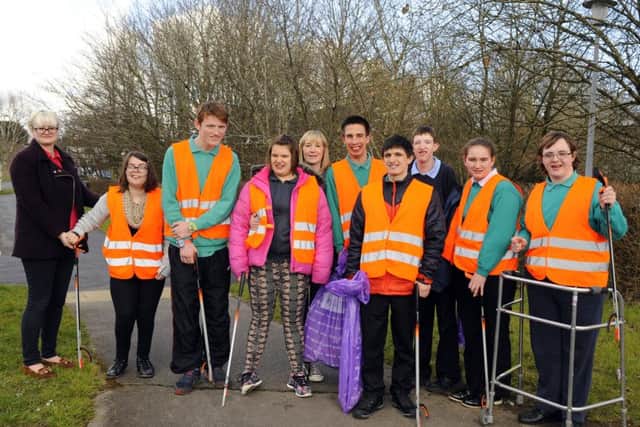 Pupils and staff from Rachel Madocks School in Eagle Avenue Cowplain head off to clean up the area near to their school as part of their 'World of Work' Picture: Malcolm Wells (160304-9282)