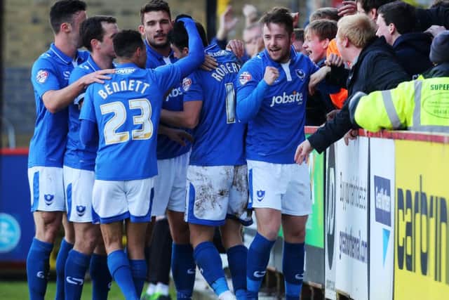 The Pompey players celebrate Marc McNulty's opener Picture: Joe Pepler
