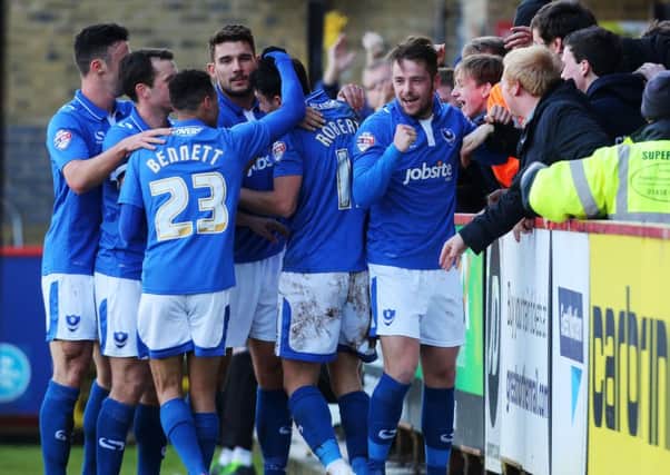 The Pompey players celebrate Marc McNulty's opener Picture: Joe Pepler