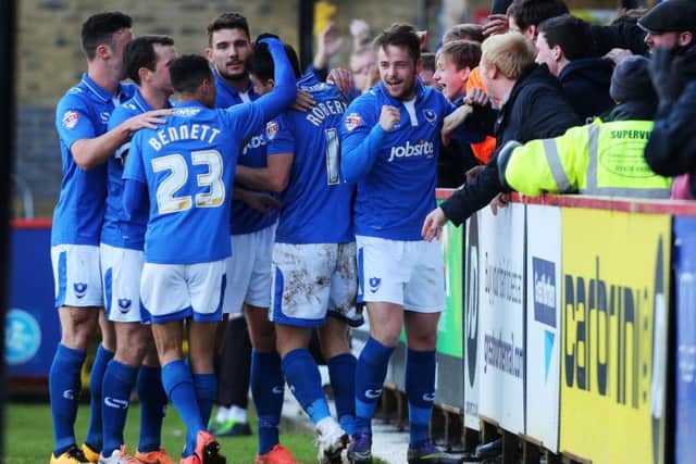 Pompey celebrate their opening goal from Marc McNulty, far right, in Saturday's 2-0 win at Stevenage    Picture: Joe Pepler