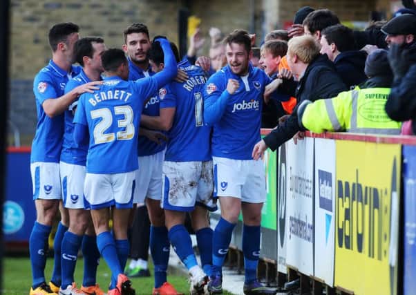 Pompey celebrate their opening goal from Marc McNulty, far right, in Saturday's 2-0 win at Stevenage    Picture: Joe Pepler