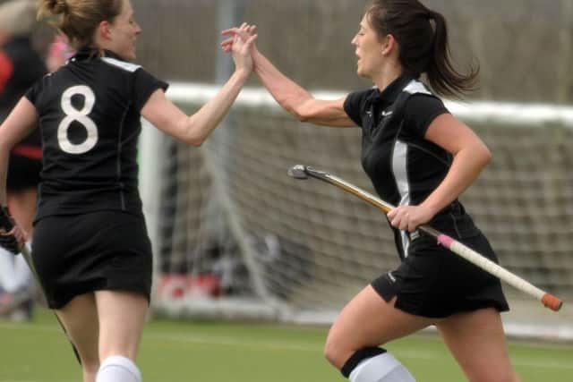 Emma Jones, right, celebrates with Victoria Field after scoring in the 3-3 draw with Wanderers at the weekend