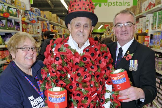 Chris and Louise Purcell with poppy man Eddie Chamberlain at  a Poppy appeal launch in Portsmouth