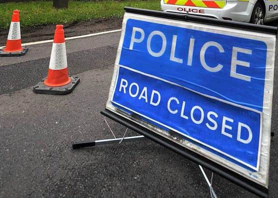 Police closed a road after an accident