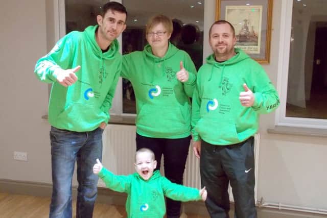From left,  Scott Simper, Charlies mum Marie Harris and Scotts brother-in-law Brett Evans with six-year-old Charlie Harris