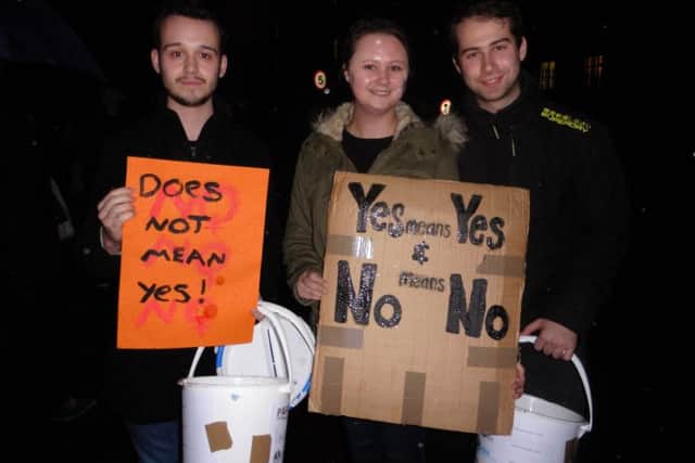 From left, David Ayton, 20, Lucie Cook, 23, and Orion Brooks, 23, at the 2016 Reclaim the Night march in Portsmouth tonight Picture: Miles O'Leary