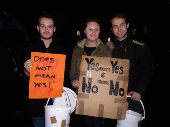 From left, David Ayton, 20, Lucie Cook, 23, and Orion Brooks, 23, at the 2016 Reclaim the Night march in Portsmouth tonight Picture: Miles O'Leary