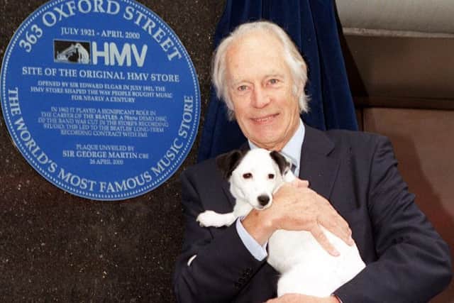 Sir George Martin pictured in 2000 with Nipper the dog at the unveiling of a plaque in Oxford Street, to record the role the HMV store played in bringing the Beatles to fame