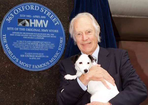 Sir George Martin pictured in 2000 with Nipper the dog at the unveiling of a plaque in Oxford Street, to record the role the HMV store played in bringing the Beatles to fame