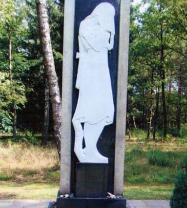 A memorial at Belsen concentration camp. It says: Here are buried 50,000 Soviet prisoners of war tortured to death in captivity by German fascists.