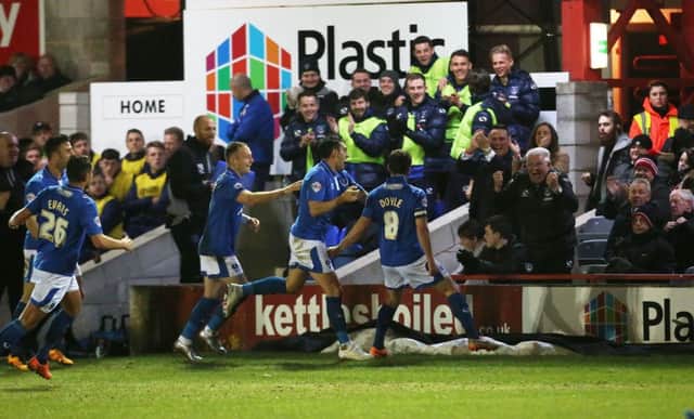 Michael Doyle celebrates his goal at Accrington in front of Pompey's dugout     Picture: Joe Pepler
