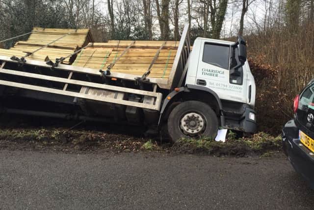 The flat bed lorry carrying fence panels slipped off the road in Broad Walk, Stansted, at 9am today