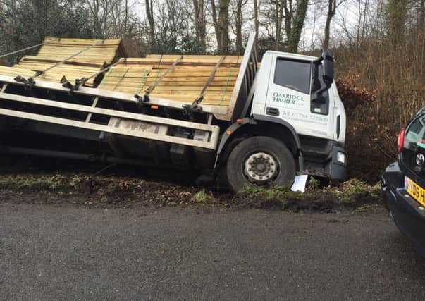 The flat bed lorry carrying fence panels slipped off the road  in Broad Walk, Stansted, at 9am today