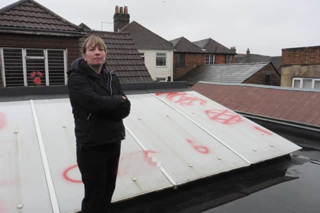 Carol Hunt, shop manager of Forces Suport in Fareham, who is angry after obscene graffiti was sprayed on the roof of her shopPicture: Olivia Meades