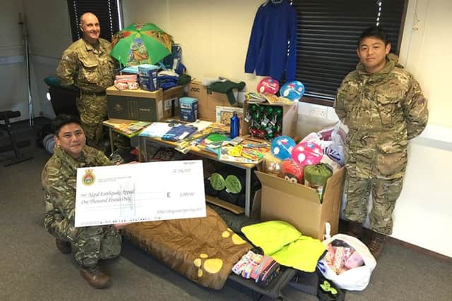 GENEROSITY From left: Private Rai Bikram, Corporal Mark Stanley and Private Rai Lawahang with the items collected 							                    Picture: Mark Stanley