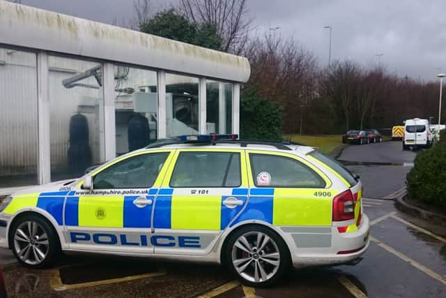 Police near Tesco petrol garage at North Harbour in Portsmouth where a body was found PPP-160903-154029001