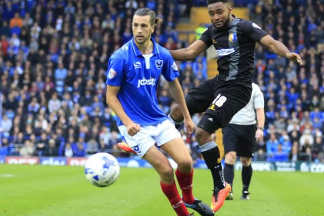 Adi Yussuf, right, in action for Mansfield at Pompey earlier in the season   Picture: Barry Zee