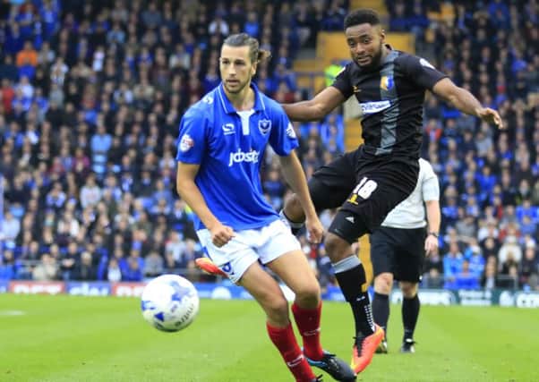 Adi Yussuf, right, in action for Mansfield at Pompey earlier in the season   Picture: Barry Zee
