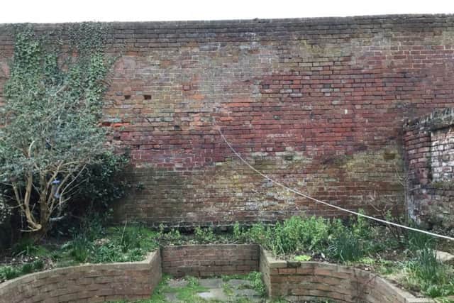 Picture taken of the wall at the back of Alhambra Road, Southsea, which is being taken down by McCarthy and Stone