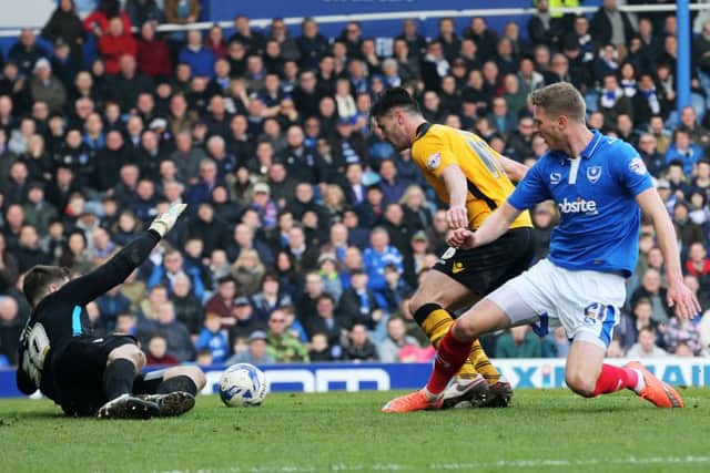 Michael Smith forces a save out of Newport keeper Joe Day Picture: Joe Pepler