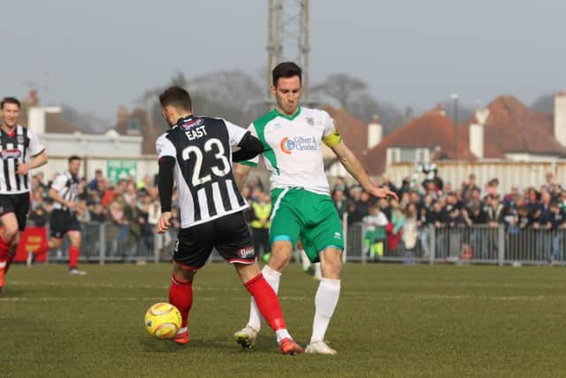 Bognor striker Jason Prior, right, clashed with Grimsby defender Danny East Picture: Tim Hale