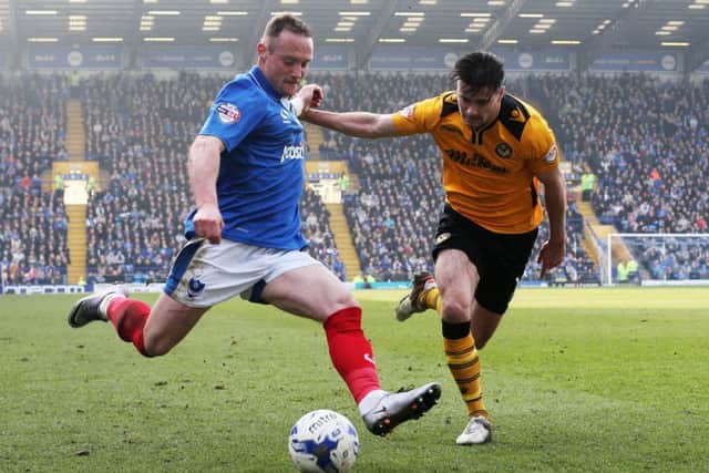 Den Davies attempts to get a cross in Picture: Joe Pepler