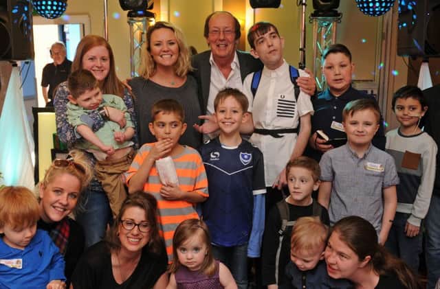 Charlie Brooks and Fred Dinenage with some of the children	
Picture Ian Hargreaves  (160353-9)