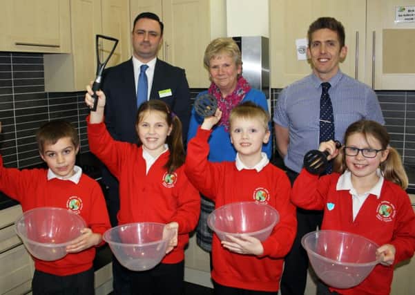 Back row L-R: Mark Mullan, Area Business Manager for The Southern Co-operative; Davina Tibbetts, Home Economist; and Darren Campbell, Head Teacher for Bishops Waltham Junior School.
Front row L-R: Aidan Dunsmore, Evie Bailey, Aiden James and Devon Cooper