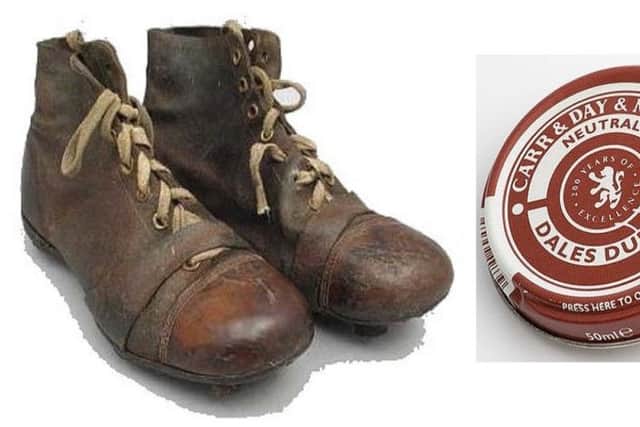 A 'proper' pair of footbal boots and a tin of dubbin
