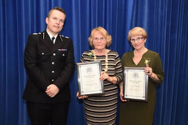 BRAVE: Linda Yorke, left, with  Patricia Fatherly, right, being presented with their bravery awards   Photo: Jan Brayley