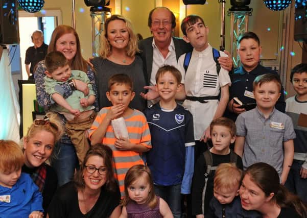 Children throughout the Portsmouth area who have long-term illness enjoy The Mad Hatters party which is held once a year at The Marriott Hotel in Portsmouth. Charlie Brooks and Fred Dinenage with the children.
Picture Ian Hargreaves  (160353-9)