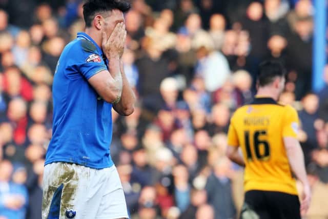 Gary Roberts looks dejected after being sent off in Saturday's surprise defeat against Newport County Picture: Joe Pepler