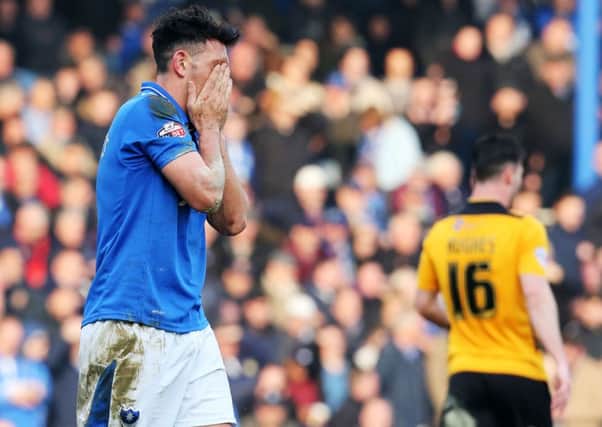 Gary Roberts looks dejected after being sent off in Saturday's surprise defeat against Newport County Picture: Joe Pepler