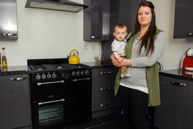 Hannah Wilson and her son Oliver in their kitchen Picture: Allan Hutchings (160399-170)