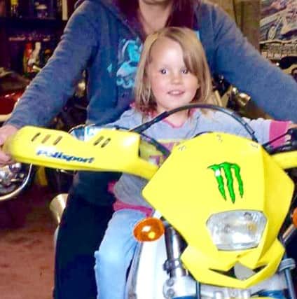 Julie Corben with her grandaughter Maisie in 2013
