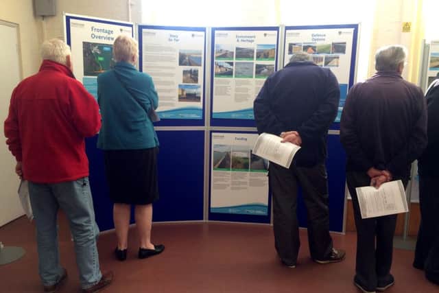 People looking at the display on flood defences Picture: Olivia Meades