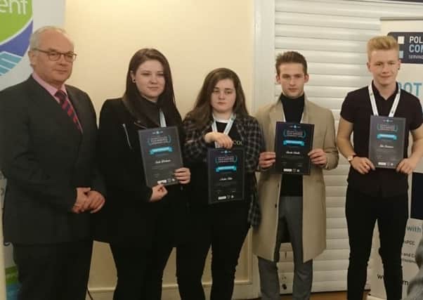 Students from Highbury College with their certificates alongside Simon Hayes, the police and crime commissioner for Hampshire