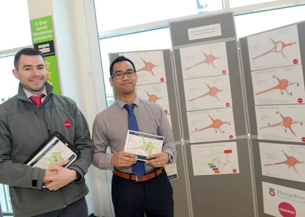 From left, Osborne site manager Matt Wilson and Chris Campos, engineer at Hampshire County Council, at the display of the Asda roundabout in Bedhampton plans 

Picture: Sarah Standing (160523-8056)