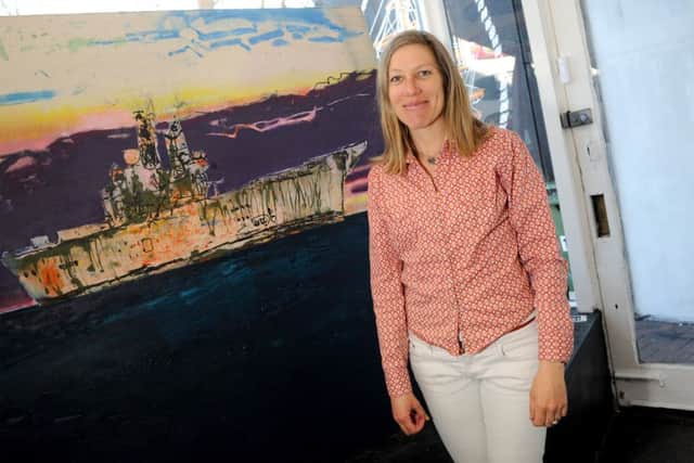 Sadie Tierney with her painting of HMS Ark Royal