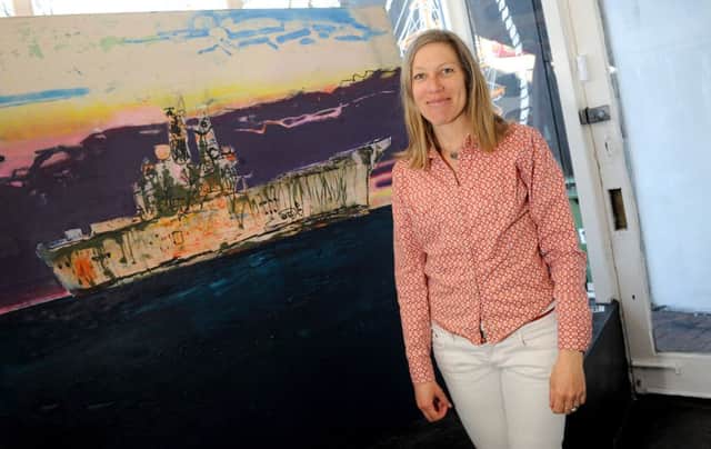 Sadie Tierney with her painting of HMS Ark Royal