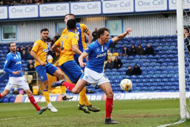 Mansfield's Ryan Tafazolli scores his own goal at the end of the first half Picture: Joe Pepler