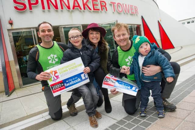 TV stars Emma Barton from EastEnders with Tim Heffield, left, and Scott Treloar from Bear Grylls Survival School, at the Spinnaker Tower with Harrison Kirk, left, seven, and Seb Fyans, three, after Tim and Scott abseiled down the tower with other fundraisers for the Portsmouth Down Syndrome Association on Saturday	           Picture: Steve Reid Blitz Photography