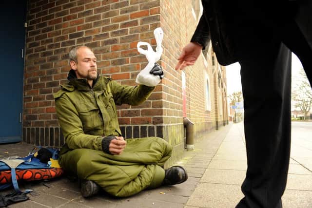 Phil Hancock is given a hot meat pie by a passer-by