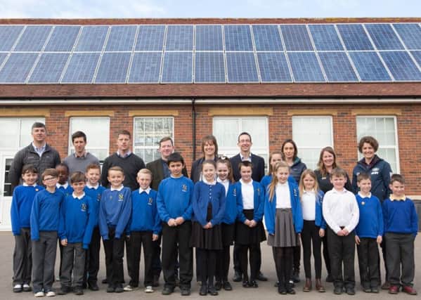Pupils at the Northern Parade schools in front of the new solar panels 

Picture: Land Rover BAR