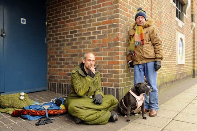 Phil Hancock with Troy Marsh and his dog Poppy in a doorway in Havant  Picture: Malcolm Wells (160318-0574)
