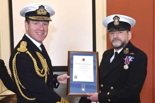 DISTINGUISHED Tim Franklin, right, receiving his award 				    Picture: LA(Phot) Ian Simpson
