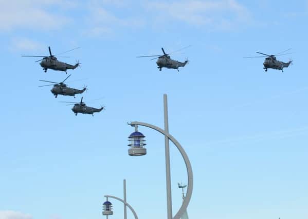 21/3/2016 (TC)

The last batch of the Royal Navy's iconic search and rescue 
helicopters flew across Portsmouth City on Monday morning.

Picture: Sarah Standing (160529-8449) PPP-160321-112718001