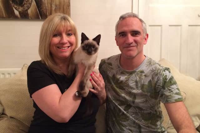 Peta and Steve Reading with their four-month-old kitten Herbie Picture: Kimberley Barber