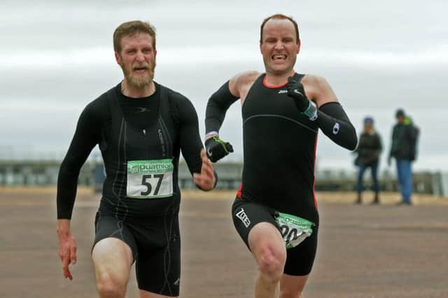 Jahan Hunter and Andy Wheeler sprint for the finish