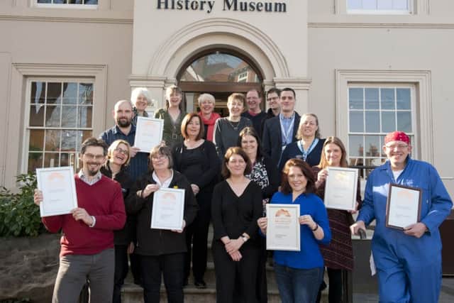 Cllr Linda Symes with staff from the museums in Portsmouth